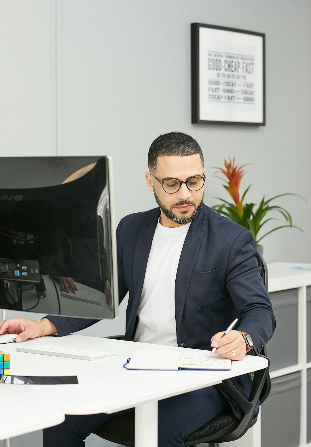 a-man-sitting-at-a-desk.jpg a man sitting at a desk